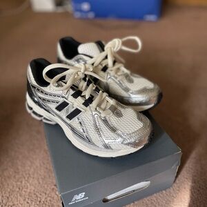 New Balance Silver and Black Sneakers